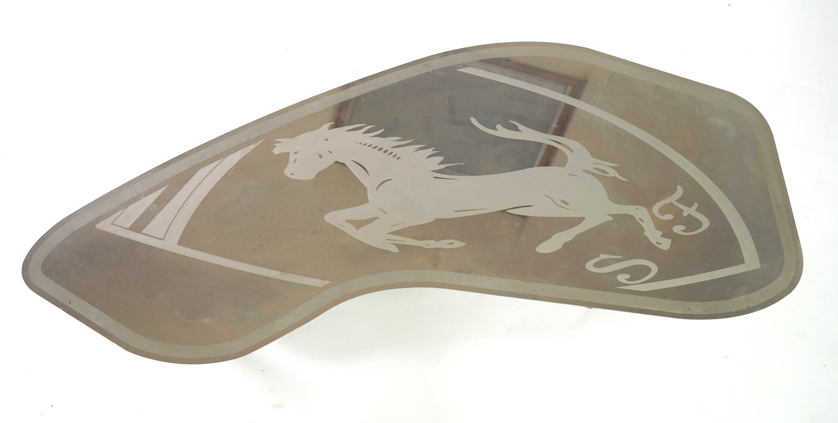 Pietro Psaier (Italian 1939-2004) A Ferrari polished steel coffee table, 1 of 3, in homage to Carlo Mollino